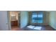 Bedroom featuring en-suite bath and natural light at 200 Saint Andrews Blvd # 2306, Winter Park, FL 32792