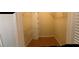Walk-in closet with tile floor, shelves, and hanging racks at 200 Saint Andrews Blvd # 2306, Winter Park, FL 32792