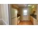 Galley kitchen with tiled floors and basic appliances and cabinets at 200 Saint Andrews Blvd # 2306, Winter Park, FL 32792