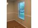 Neutral colored room with a window with blinds and trim at 200 Saint Andrews Blvd # 2306, Winter Park, FL 32792