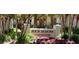 Four Seasons Condominium sign with manicured landscaping and flowers at 200 Saint Andrews Blvd # 2306, Winter Park, FL 32792