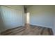 This bedroom offers a closet, wood-look flooring, and neutral paint at 2406 Sw 163Rd Pl, Ocala, FL 34473