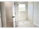 This bathroom features a walk-in shower, neutral finishes, and bright window at 2697 Sw 165St Rd, Ocala, FL 34473