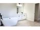 Bright bathroom boasts double vanity, black fixtures, and a modern tub at 2697 Sw 165St Rd, Ocala, FL 34473
