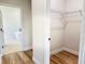 Walk-in closet features wood-look floors and metal shelving at 2697 Sw 165St Rd, Ocala, FL 34473