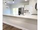 Modern kitchen featuring white cabinets, stainless steel appliances, and a spacious quartz countertop at 2697 Sw 165St Rd, Ocala, FL 34473