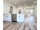 Modern kitchen featuring white cabinets, stainless steel appliances, and a spacious quartz countertop at 2697 Sw 165St Rd, Ocala, FL 34473