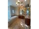 Bathroom with a soaking tub, vanity with granite countertop and a chandelier at 708 Palenci Ct, Winter Springs, FL 32708