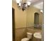 A well-lit half bathroom with a mirror and sink at 708 Palenci Ct, Winter Springs, FL 32708