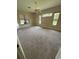 Spacious bedroom with plush carpeting, a ceiling fan, and ample natural light from the large window at 708 Palenci Ct, Winter Springs, FL 32708