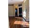 Welcoming entryway featuring a modern dark door and sleek hardwood floors at 708 Palenci Ct, Winter Springs, FL 32708