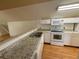 An upstairs kitchen with stainless appliances and laminate floors at 708 Palenci Ct, Winter Springs, FL 32708