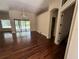 Bright living area with ceiling fan, hardwood floors and pool views through sliding doors at 708 Palenci Ct, Winter Springs, FL 32708