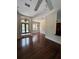 Open living area with wood floors, a ceiling fan, and abundant natural light at 708 Palenci Ct, Winter Springs, FL 32708
