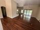 Open living space with hardwood floors and sliding glass doors to the pool area at 708 Palenci Ct, Winter Springs, FL 32708