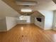 Spacious living room featuring modern flooring, ceiling fan, and a mounted television at 708 Palenci Ct, Winter Springs, FL 32708