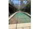 Screened-in pool with waterfall feature and ample deck space for relaxation and recreation at 708 Palenci Ct, Winter Springs, FL 32708