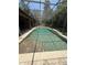 Screened-in pool with waterfall feature and ample deck space for relaxation and recreation at 708 Palenci Ct, Winter Springs, FL 32708