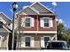 Charming two-story home featuring white shutters, a gable roof, and a well-maintained exterior at 7514 Sunville Ave, Kissimmee, FL 34747