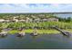 A beautiful waterfront community with private boat docks, and lush landscaping, with access to a beautiful lake at 7624 Pointe Venezia Dr, Orlando, FL 32836