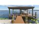 Waterfront home featuring covered boat dock with lift and beautiful water views at 7624 Pointe Venezia Dr, Orlando, FL 32836