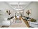 Elegant living area with decorative ceilings, tile floors, and lots of natural light at 7624 Pointe Venezia Dr, Orlando, FL 32836