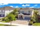 An aerial view of this luxurious home with a large driveway and well maintained landscaping at 7644 Fairfax Dr, Kissimmee, FL 34747
