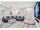 Finished basement features a large sectional sofa, movie projector and screen for entertainment at 7644 Fairfax Dr, Kissimmee, FL 34747