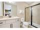 Tastefully decorated bathroom featuring a shower and a granite topped vanity at 7644 Fairfax Dr, Kissimmee, FL 34747