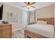 Inviting bedroom with warm tones, wood floors, and ample closet space at 7644 Fairfax Dr, Kissimmee, FL 34747