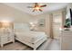 This cozy bedroom showcases a ceiling fan and plenty of natural light at 7644 Fairfax Dr, Kissimmee, FL 34747
