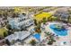 Stunning aerial view of the clubhouse featuring a waterpark, and pool, perfect for recreation and relaxation at 7644 Fairfax Dr, Kissimmee, FL 34747