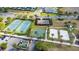 Aerial view showcasing the tennis and basketball courts, and sand volleyball courts in the community at 7644 Fairfax Dr, Kissimmee, FL 34747