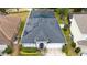 Aerial shot of the home, highlighting its backyard, roof solar panels and proximity to neighboring houses at 826 Jade Forest Ave, Orlando, FL 32828