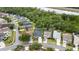 Aerial view of a neighborhood, showcasing the home's location near green spaces and a body of water at 826 Jade Forest Ave, Orlando, FL 32828