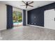 Bedroom with sliding glass doors to the pool area and modern sliding barn door at 826 Jade Forest Ave, Orlando, FL 32828