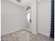 Inviting foyer features a decorative glass front door and wood-look tile flooring at 826 Jade Forest Ave, Orlando, FL 32828