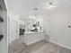 Open-concept kitchen with sleek appliances, white cabinets, and modern fixtures offers a clean, functional design at 826 Jade Forest Ave, Orlando, FL 32828