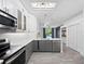 Bright kitchen with stainless steel appliances, modern lighting, and a view of the outdoor pool at 826 Jade Forest Ave, Orlando, FL 32828