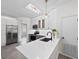 Bright kitchen with white quartz countertops, stainless steel appliances, and a stylish faucet at 826 Jade Forest Ave, Orlando, FL 32828
