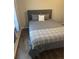 Cozy bedroom with a comfortable bed and neutral decor at 9400 Se 119Th St, Belleview, FL 34420