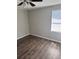 Bright bedroom featuring vinyl wood flooring and a window at 9400 Se 119Th St, Belleview, FL 34420