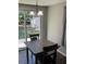 Eat-in kitchen featuring a sliding glass door to the backyard at 9400 Se 119Th St, Belleview, FL 34420