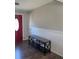 Home foyer with a wood-look bench and the red front door with decorative glass at 9400 Se 119Th St, Belleview, FL 34420