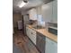 Modern kitchen featuring sleek stainless steel appliances and bright white cabinets at 9400 Se 119Th St, Belleview, FL 34420