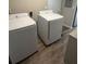 Bright laundry room featuring modern white Samsung washer and dryer appliances at 9400 Se 119Th St, Belleview, FL 34420