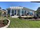 Backyard with covered patio and landscaped garden at 9872 Sw 75Th Street Rd, Ocala, FL 34481