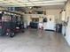 Spacious garage with ample storage, shelving, and organization, providing room for vehicles and hobbies at 9872 Sw 75Th Street Rd, Ocala, FL 34481