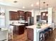 Gourmet kitchen with stainless steel appliances, granite countertops, and a breakfast bar at 9872 Sw 75Th Street Rd, Ocala, FL 34481
