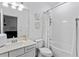 Clean bathroom featuring a shower-tub combination, vanity, toilet, and decorative accents at 308 Rustic Loop, Sanford, FL 32771